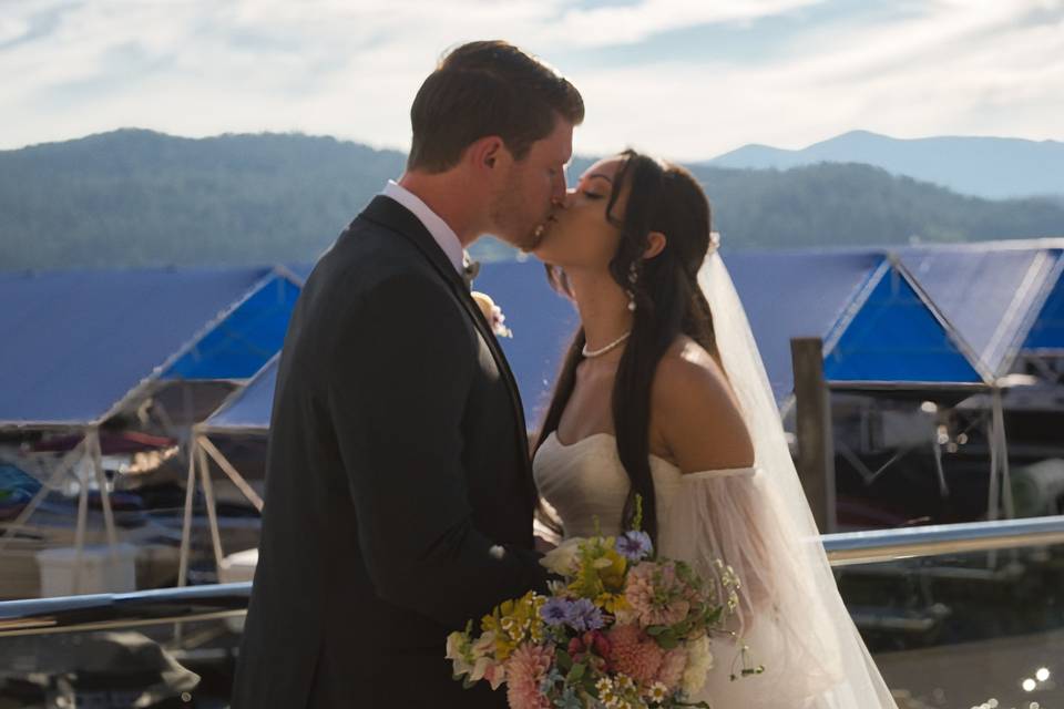 Couple kissing with lake view