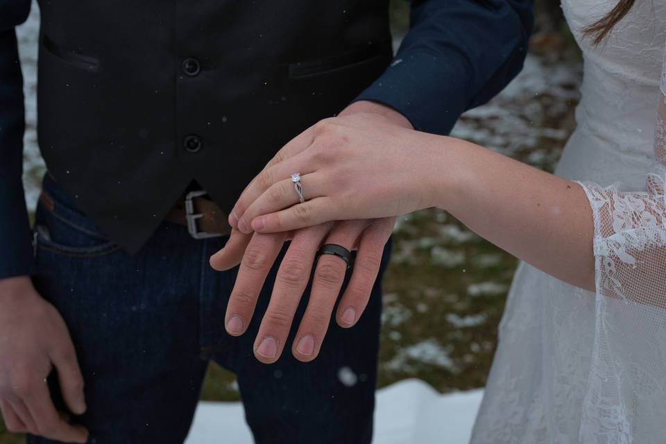 Wedding rings on couple