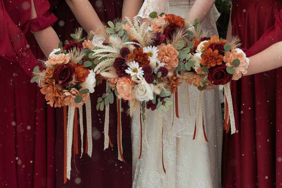 Bridesmaids holding bouquets.