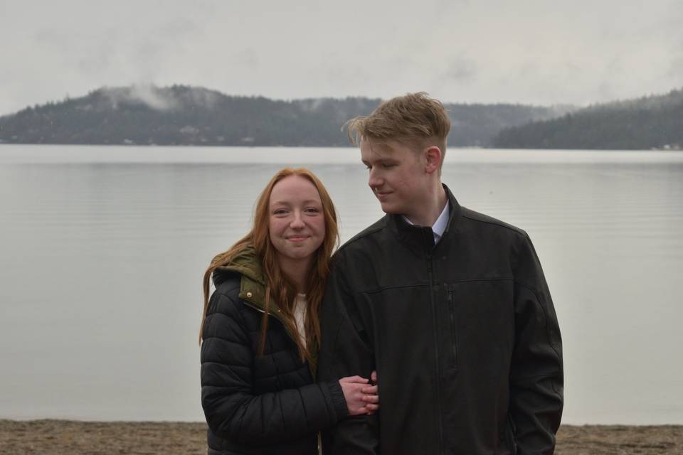 Couple next to foggy lake