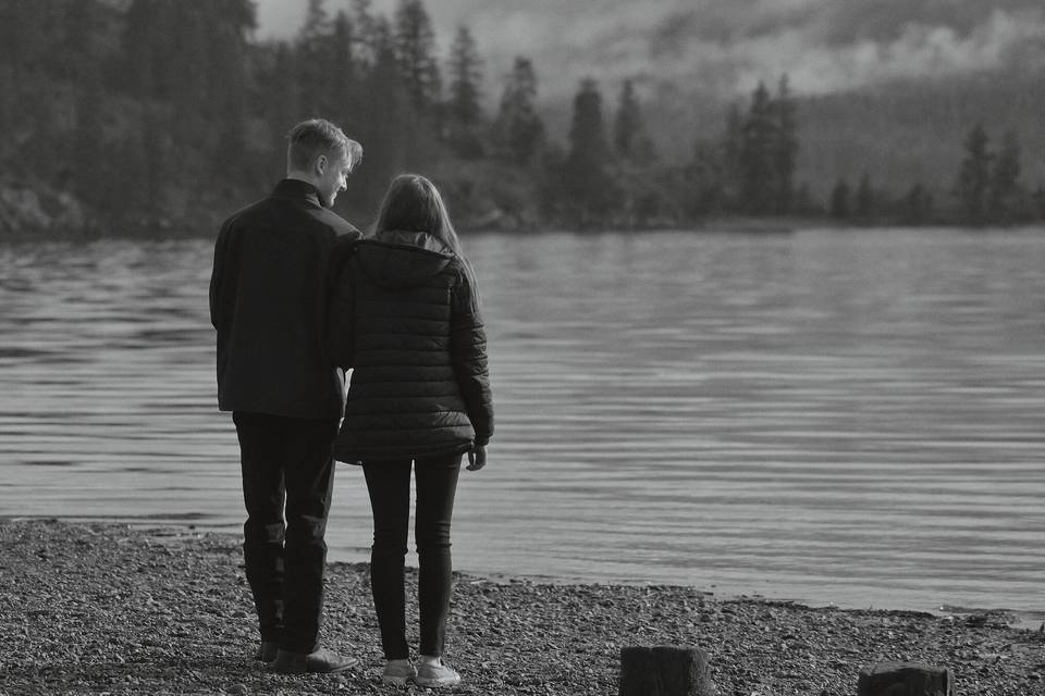 B&W couple next to lake.