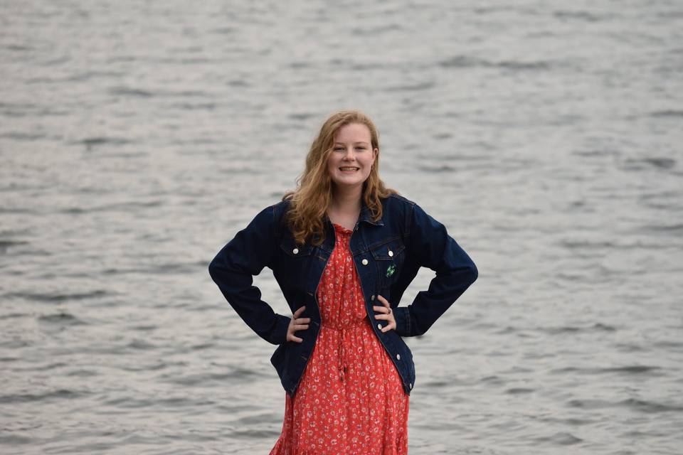 Confident girl by lake
