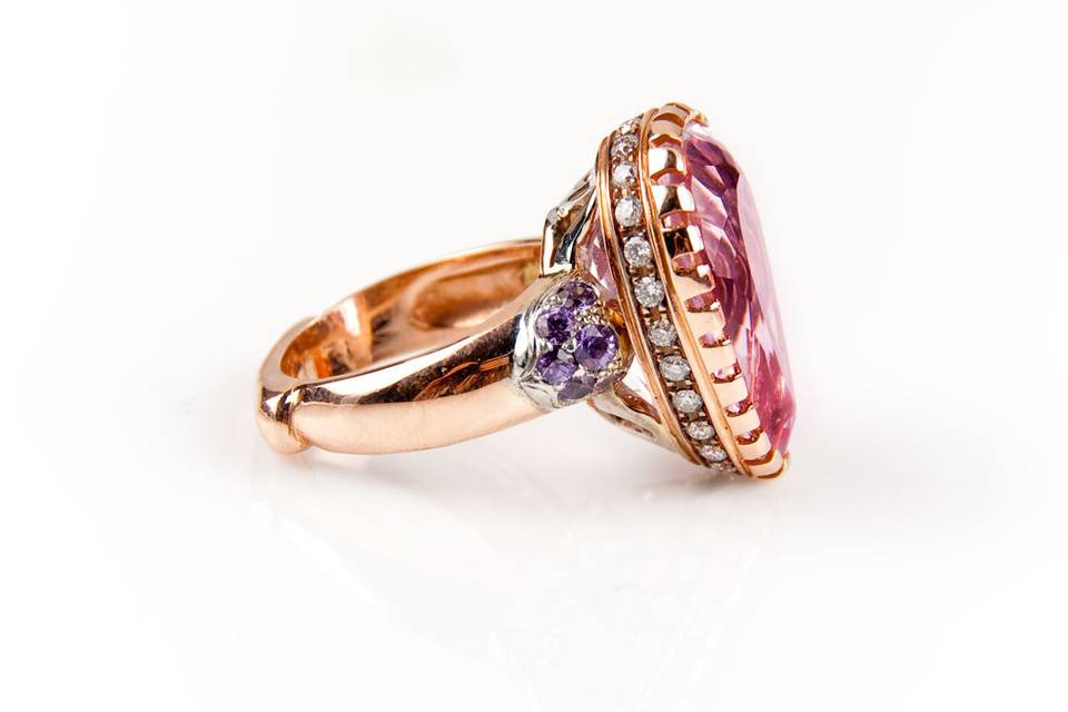 Side view of this 16 carat Kunzite ring. Love the compliment the purple Sapphires give to the center stone.