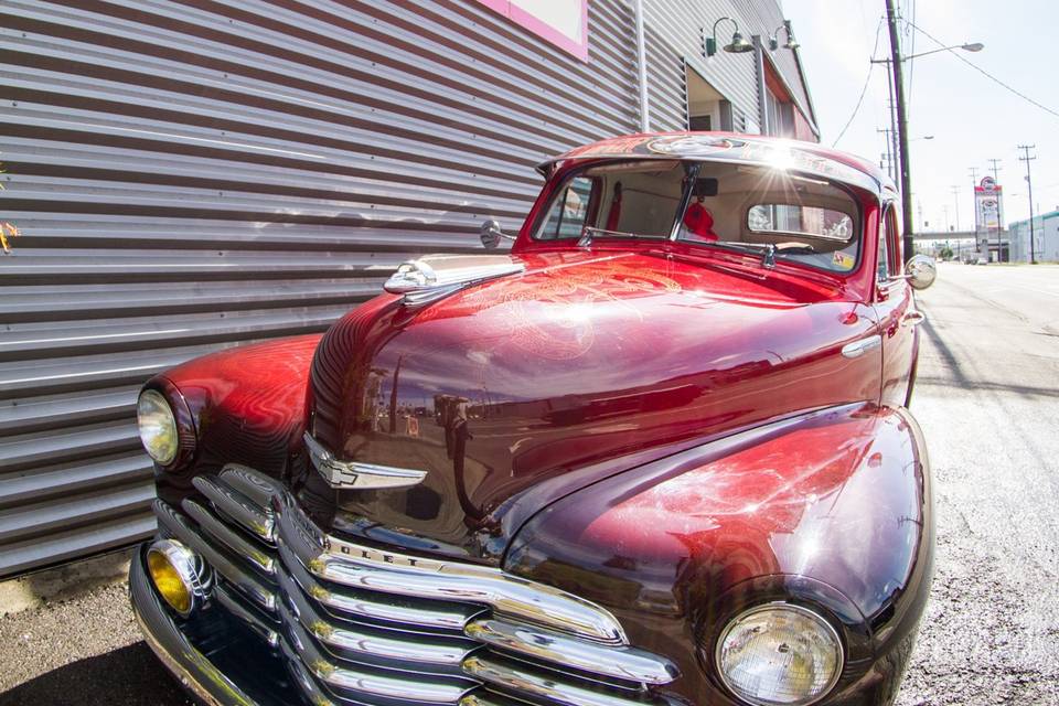 Emerald City Trapeze has their very own classic car! Decked out in stunning fire-colors, this vehicle makes the perfect backdrop for photos!
