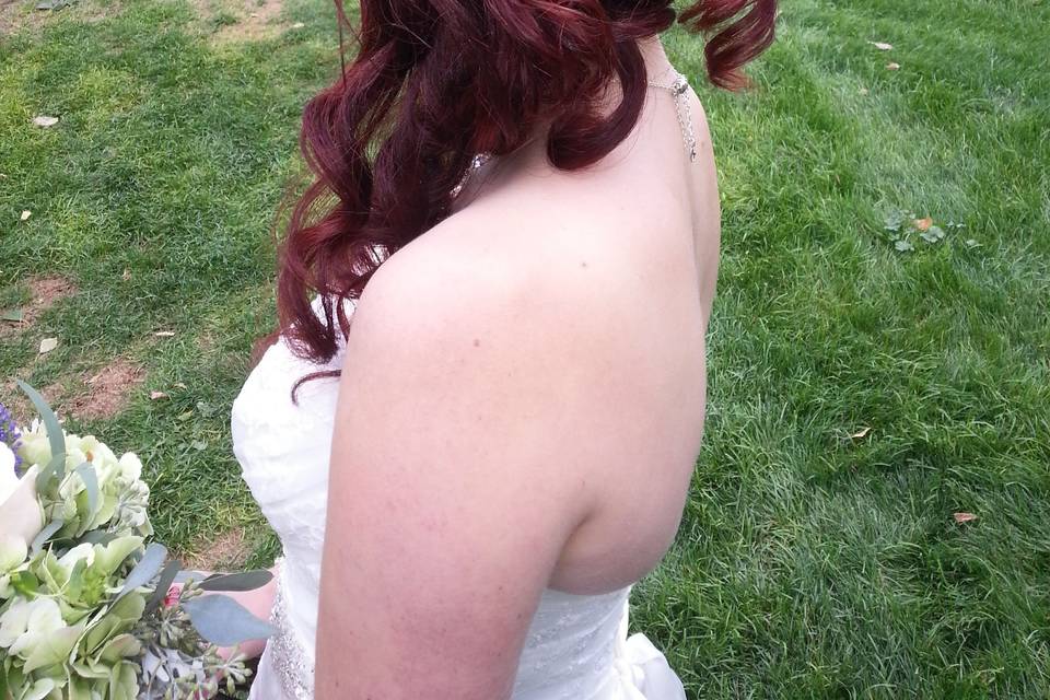 Side partial updo with flowers