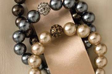 these pearls are a classic! 4 luscious strands of fresh water pearls and coin pearls. Notice the design detail