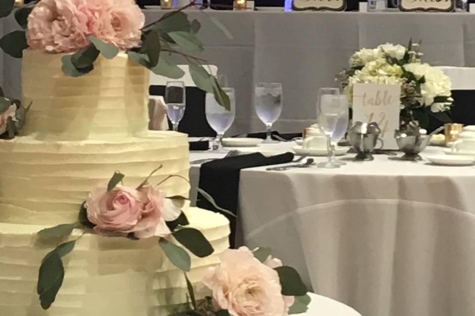 White wedding cake with pink roses