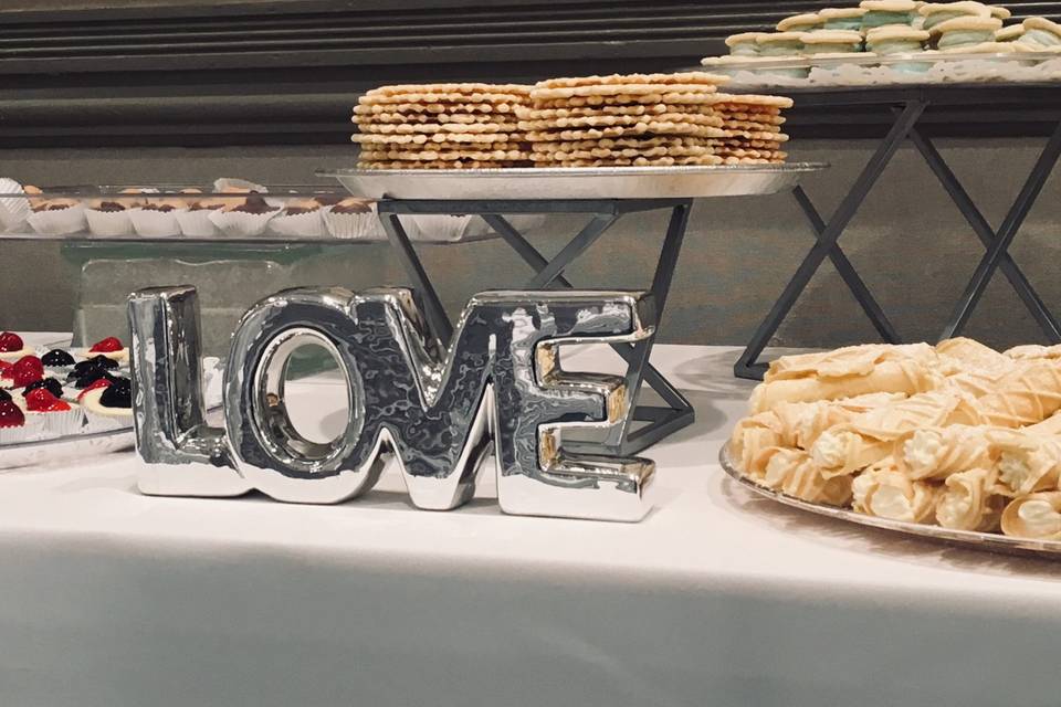 A cookie table with the word love on it
