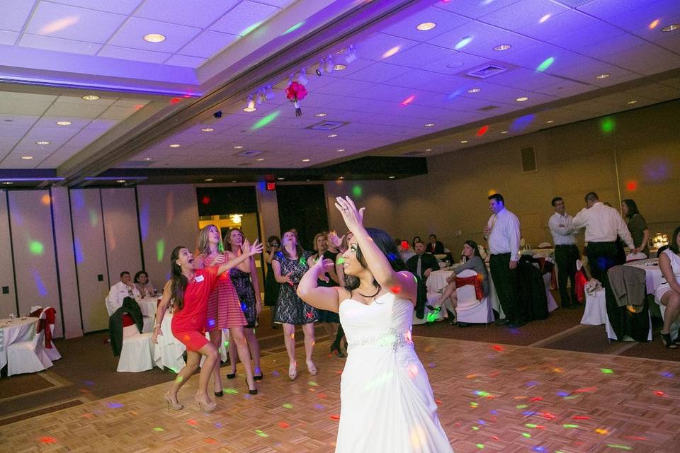 Bride tossing her bouquet