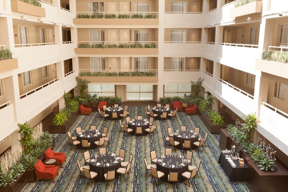 Mezzanine level- a gorgeous setting at the base of our 8 floor guestroom atrium.