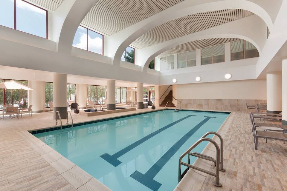 Unwind and read the newspaper by our beautiful indoor pool with outside seasonal deck seating