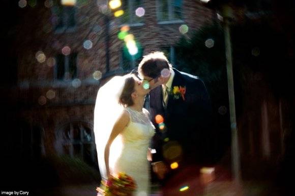 John and Pam share their first kiss as husband and wife in the starburst sunset after their ceremony in Seattle, WA.