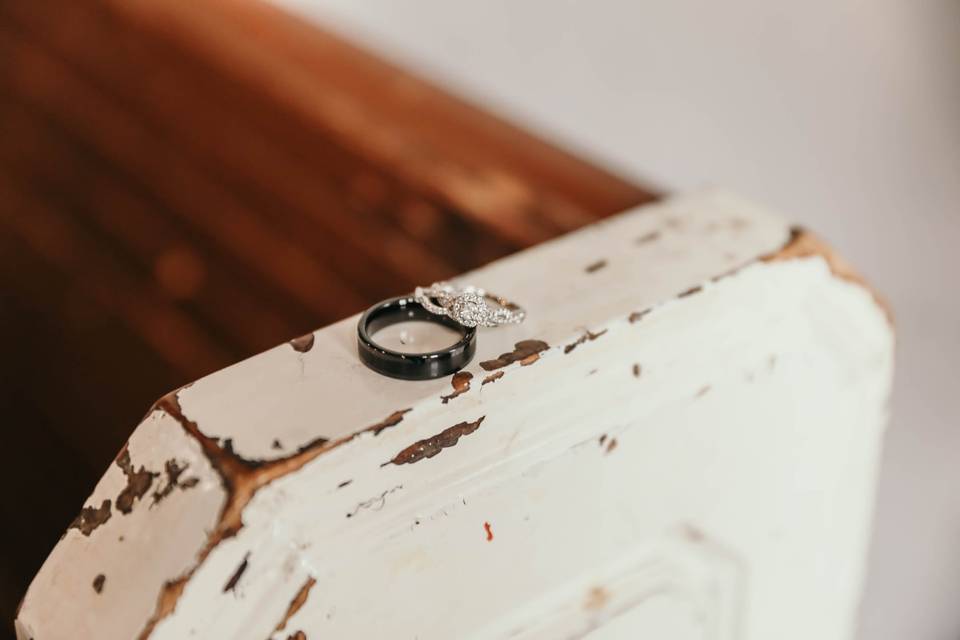 Wedding bands on rustic bench