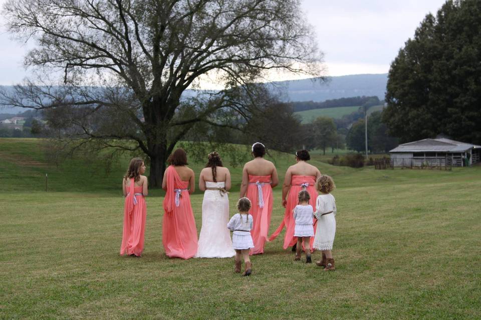 Bride with bridesmaid and flower girls