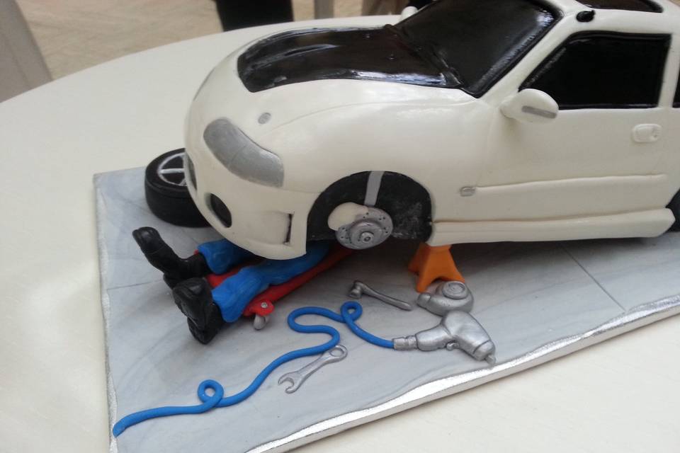 Honda Grooms cake for a groom who loves turning wrenches on his car.  boots are his favorite pair!
