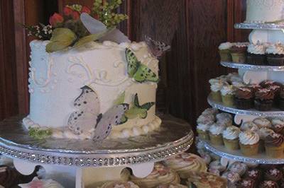 Butterfly cutting cake and cupcake tower