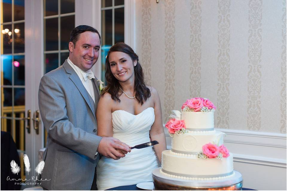 Newlyweds about to cut cake