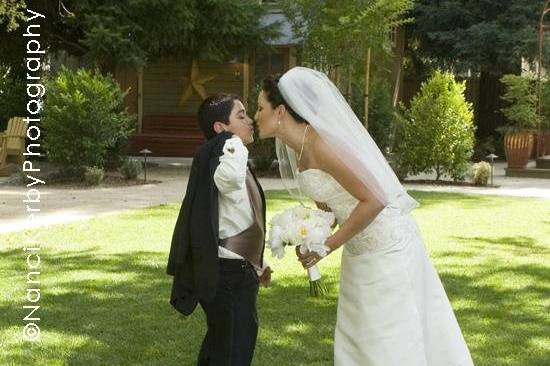 Bride giving her son a good luck kiss before the ceremony