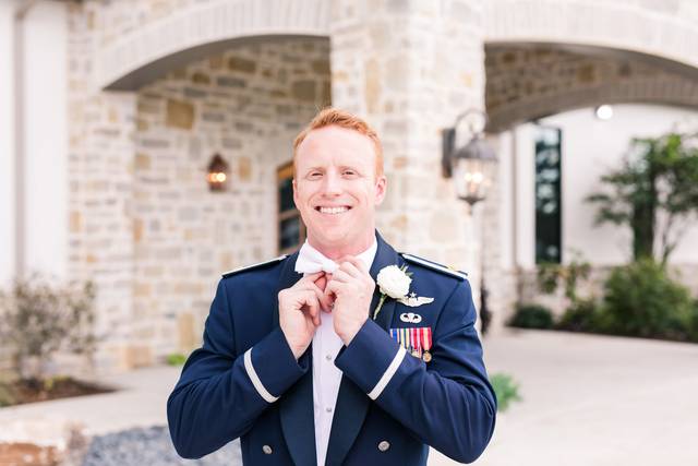 Groom fixing his bow
