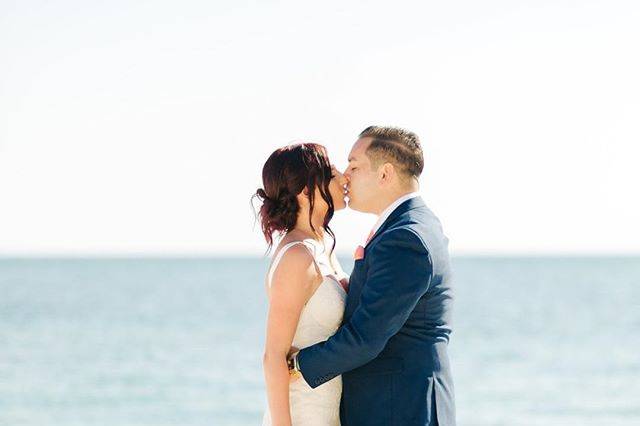 Couple kissing by the sea