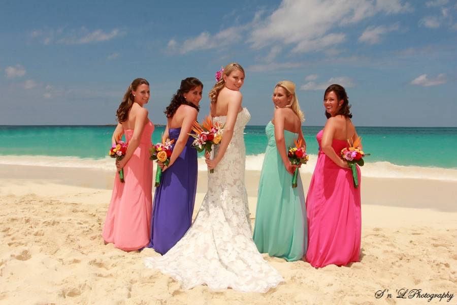 Bride and bridesmaids by the beach