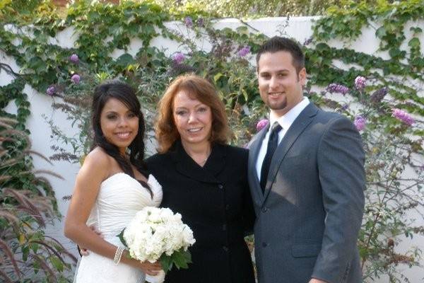 Bride and groom with the officiant