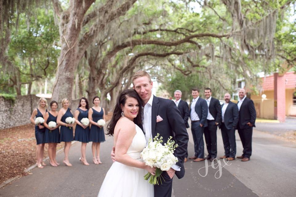 The couple with the bridesmaids and groomsmen