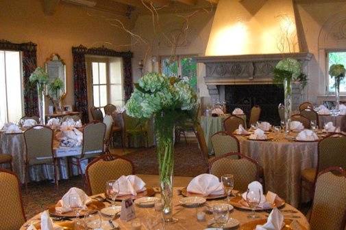 Tall green hydrangea floral centerpieces at Club Continental.