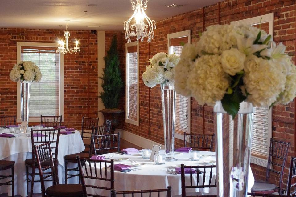 Tall all white floral centerpieces at The White Room in St Augustine Fl