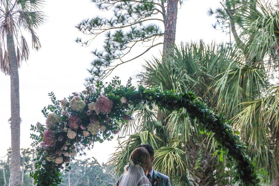 Greenery on aisle chairs