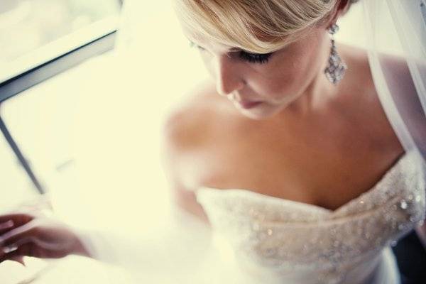 Elegant, artistic bridal portraiture. Getting ready photo. Photographed at The Oread Hotel in Lawrence, Kansas. Wedding was  a KU affair.