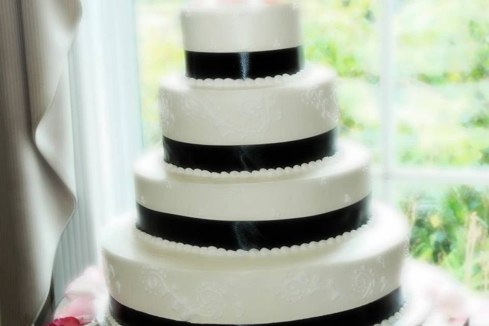 Elegant cake with monogram topper