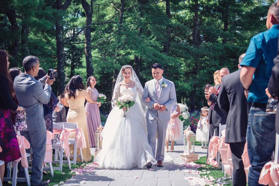 Armando and Zayda walking down the aisle