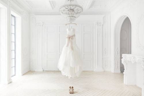 Bridal dress and shoes in a white room