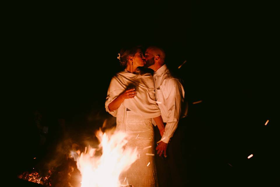 Kiss by the fire pit