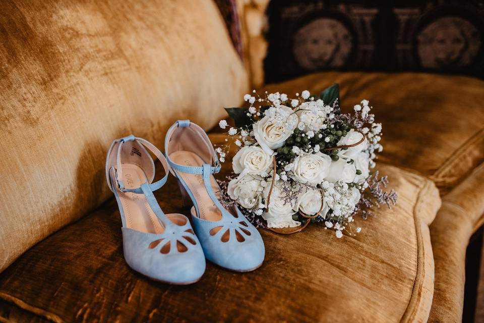 Bridal shoes and bouquet | Photo: Lacey White Photo Co