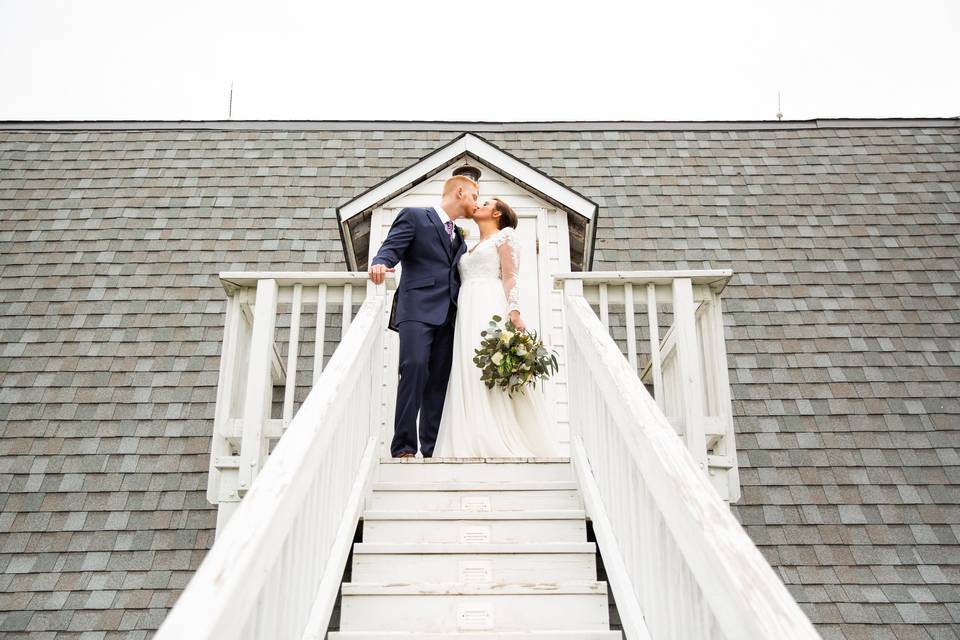 Bride and Groom on Barn Stairs