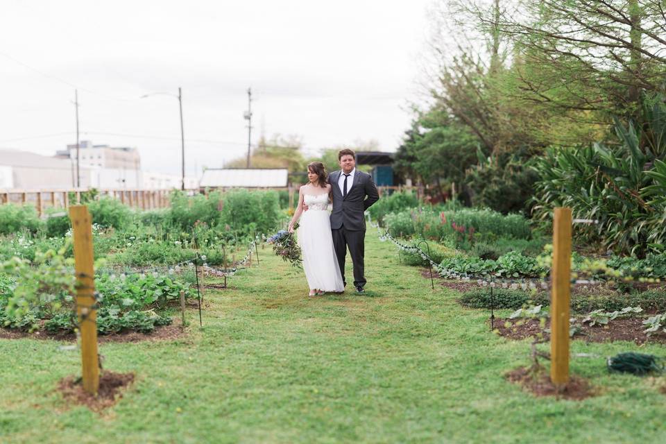 Newlyweds stroll through the greenery