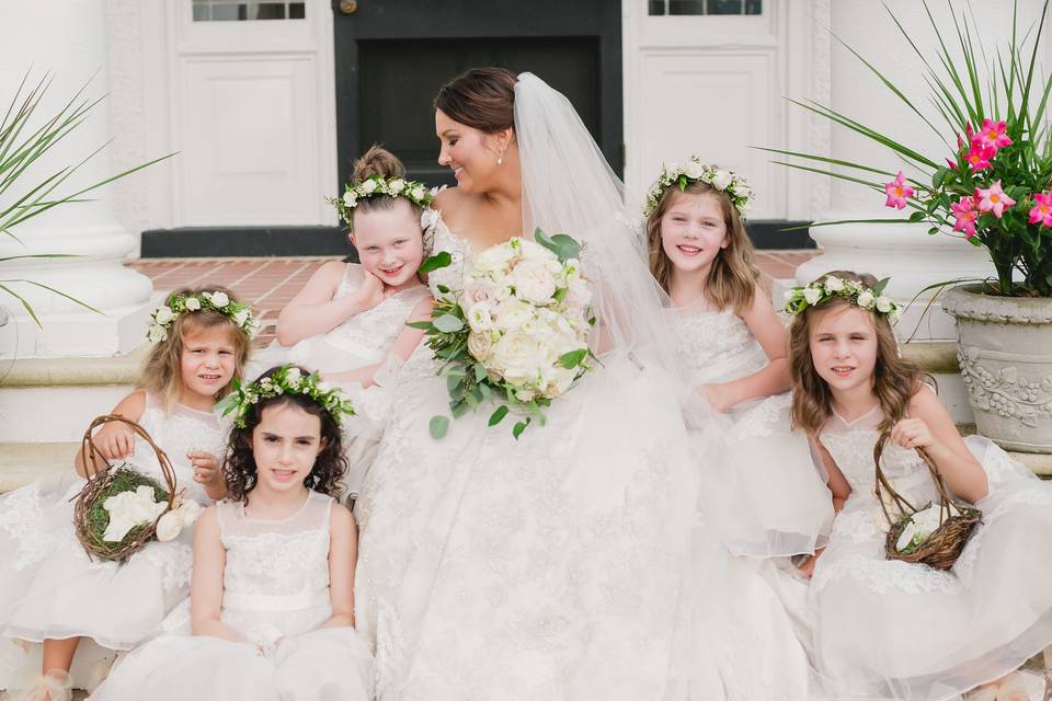 Beautiful bride with flower girls