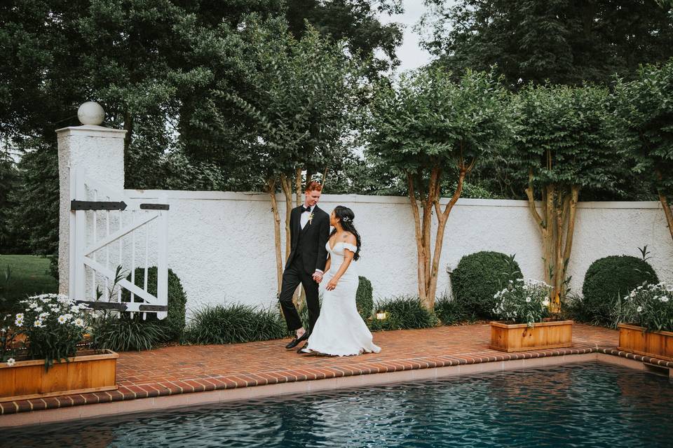 Couple passing the pool