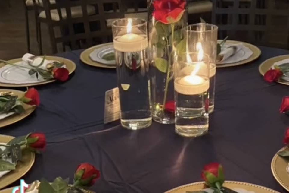 Red rose with clear candle
