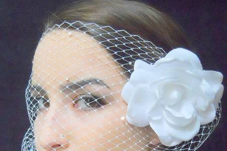 Birdcage style, bandeau veil with Russian veiling dotted with Swarovski crystals. included is a silk Gardenia flower on an alligator hair clip that you can wear in your hair during your reception.