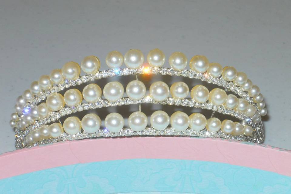 Demi- tiaras of rhinestones and pearls to place in front of your wedding day up-do.