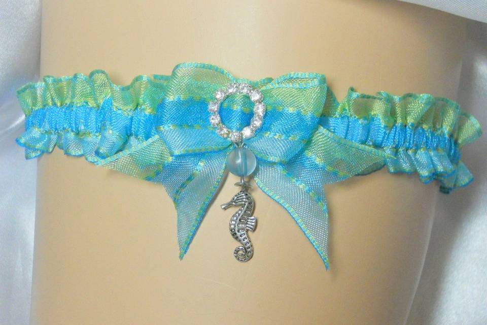Oceanic blues with crystal clasp and dangling sea horse.
