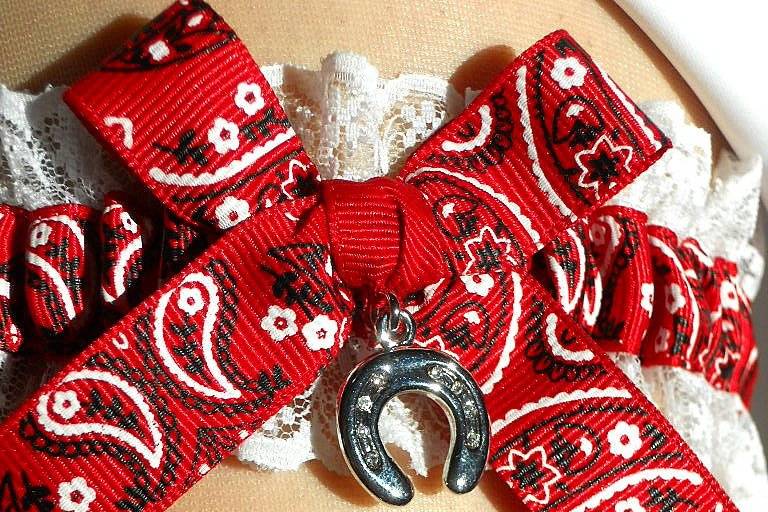 Country Western style garters in traditional bandana print gussied up with lace and silver charms of a hat, boots and a horseshoe for good luck!