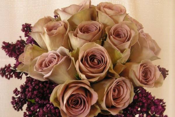 Handtied bouquet of roses and lilacs