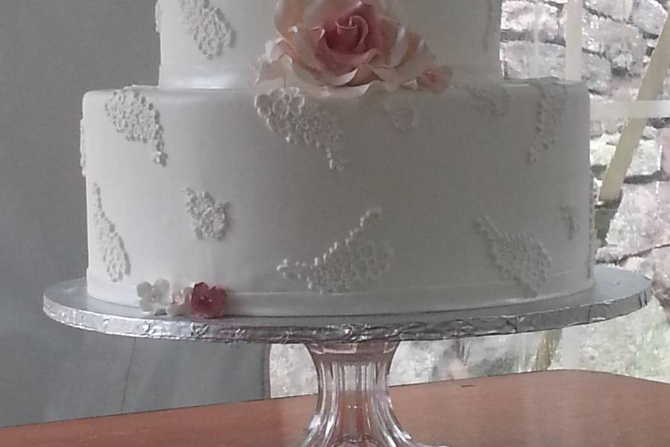 3-tier wedding cake with pink flowers