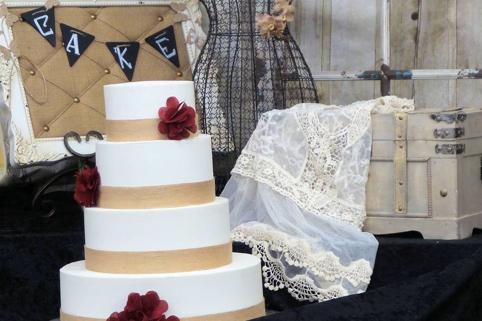 4-tier white and gold wedding cake