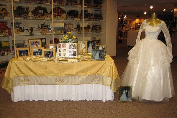 50th Wedding Anniversary - Bride's original wedding gown plus wedding photos displayed.