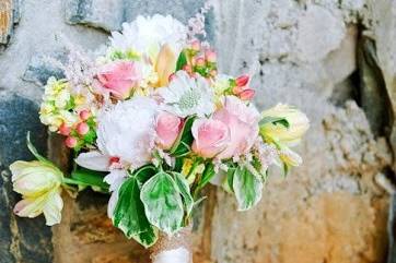 The bouquet resting against stone wall, Photo Credit: Autumn Cutia Photography